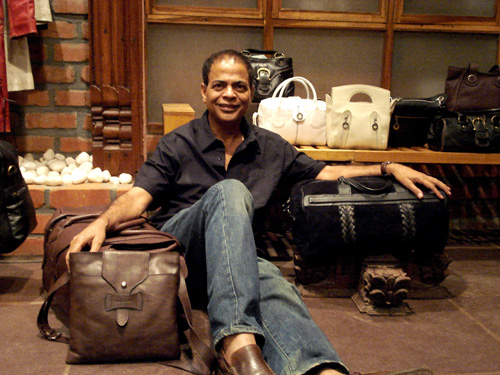 Dilip Kapur Hidesign in shop with bags